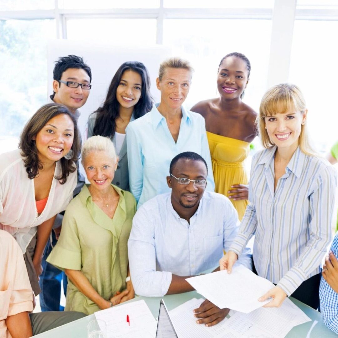 A group of people standing around each other.