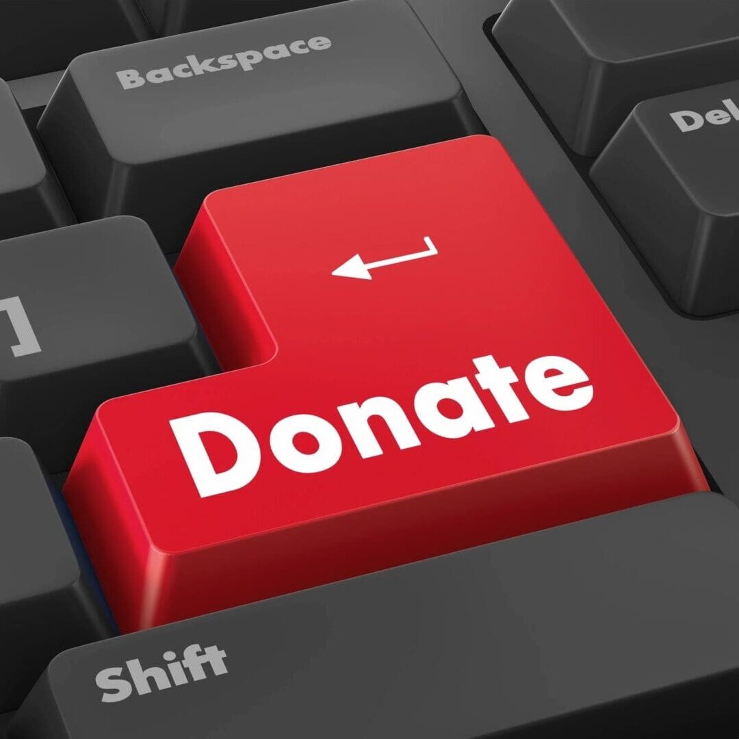 A keyboard with the word donate on it.